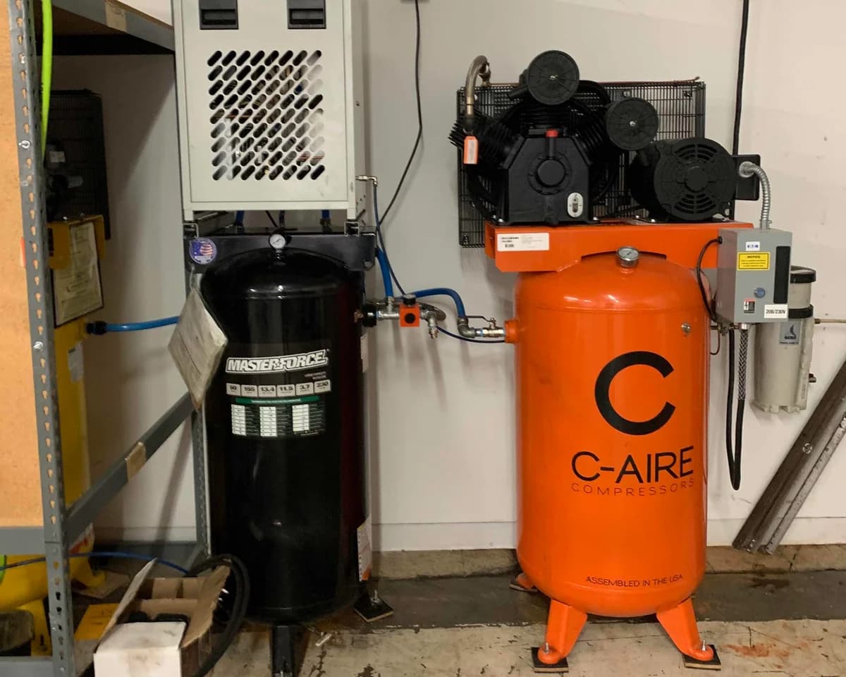C-Aire 7.5 HP Vertical Piston Compressor at Clothing Factory in Saint Paul, MN